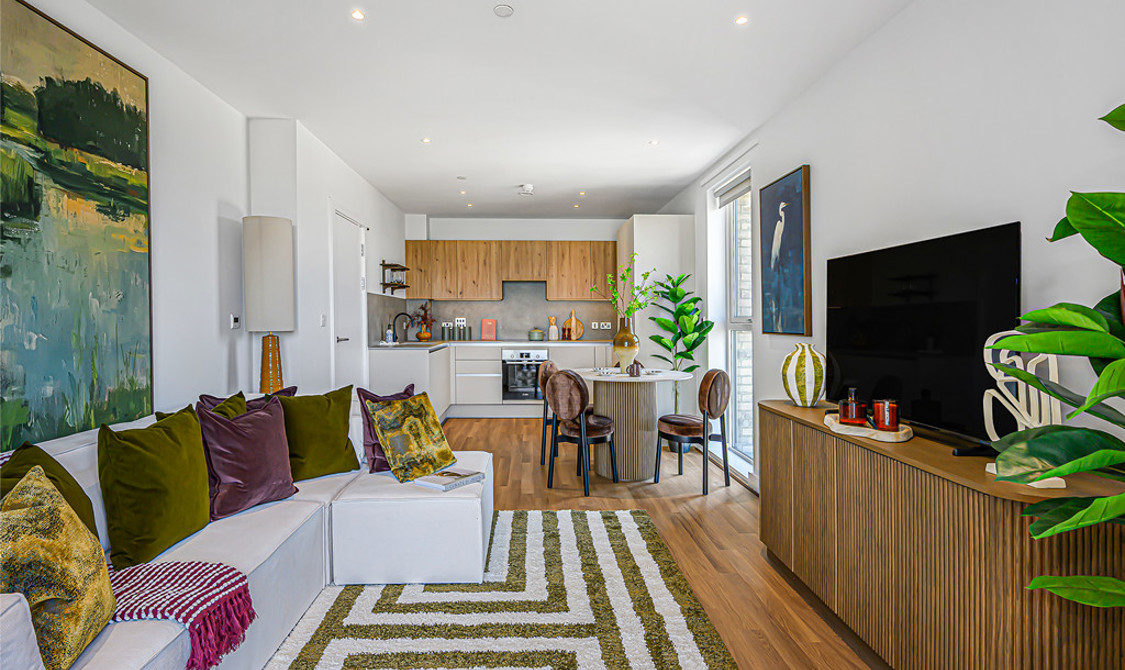An open-plan apartment with contemporary interior and large windows providing plenty of natural light.