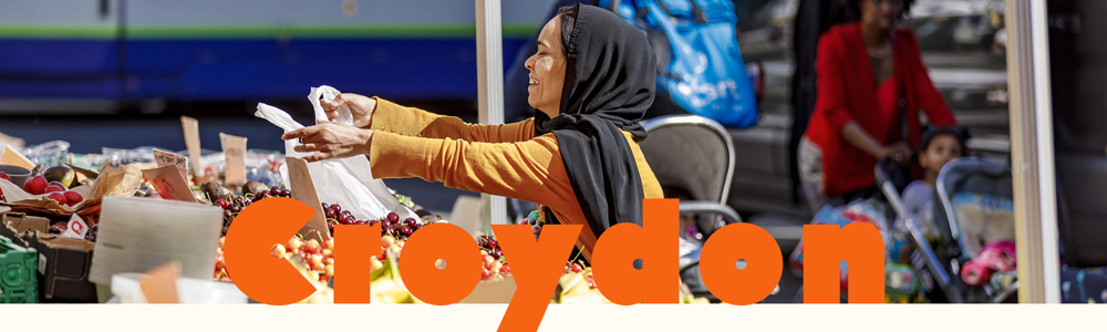 Croydon Header banner with a lady collecting fruit from a market stall