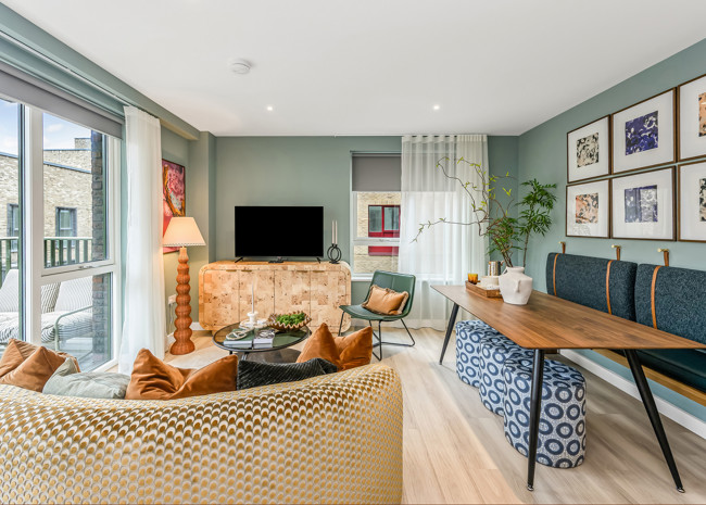 A stylist open-plan living and dining area, with plenty of natural light from the private balcony.